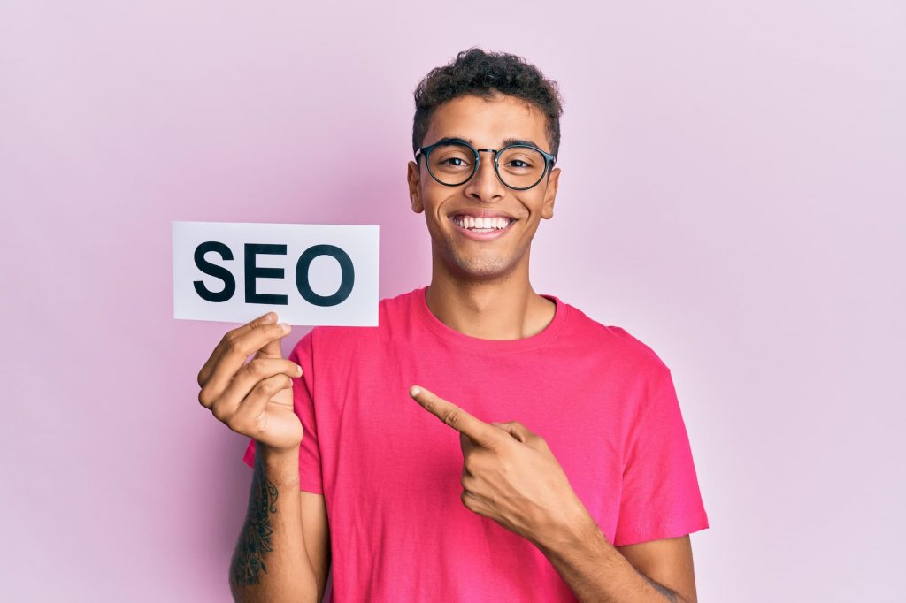SEO fundamentals, young man with label seo