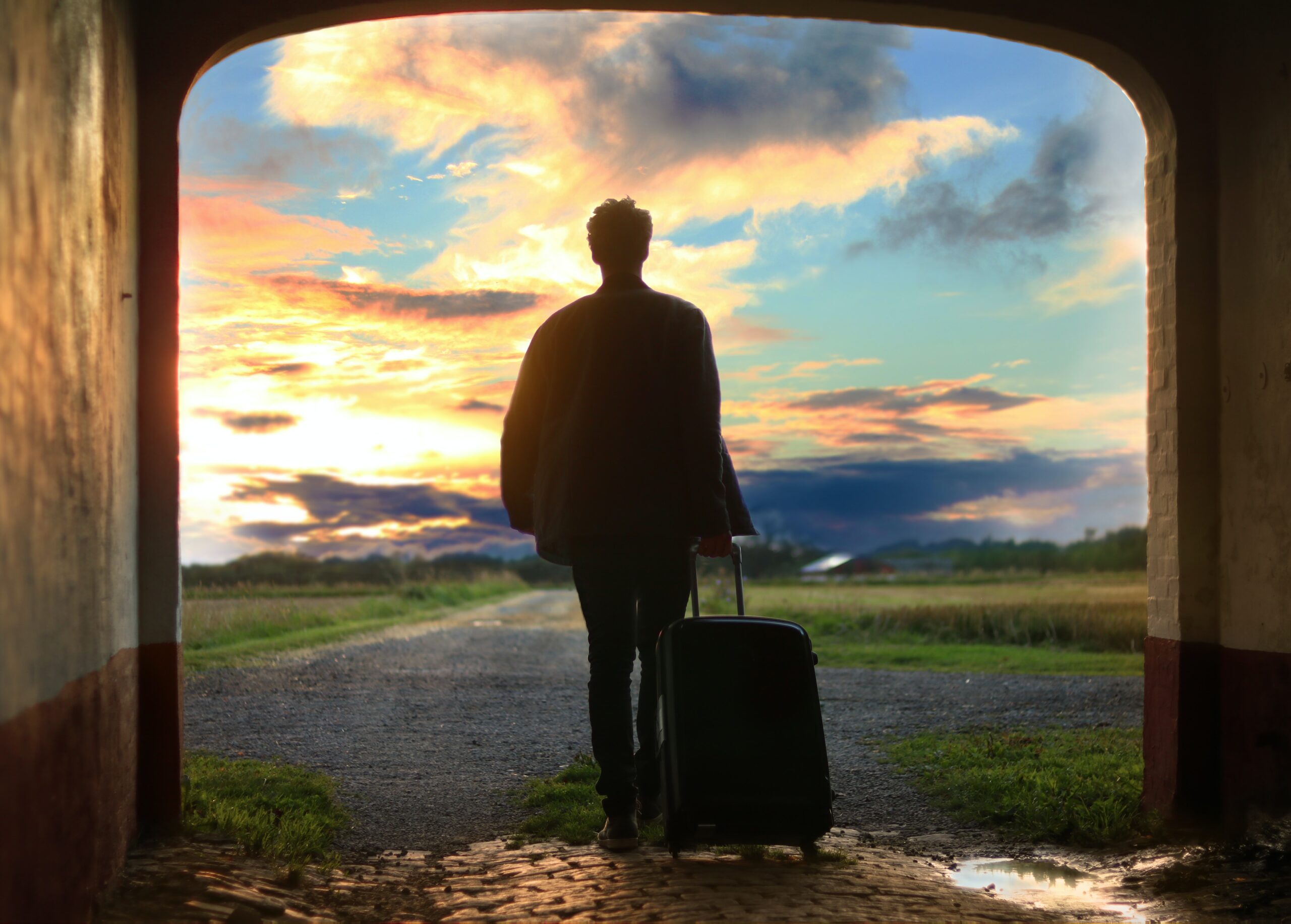 person holding a trolley bag