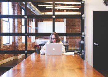 women work on mac in startup office